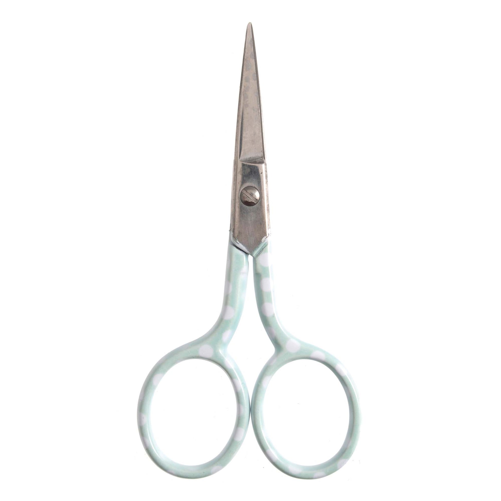 Pale blue polka dot scissors on a white background