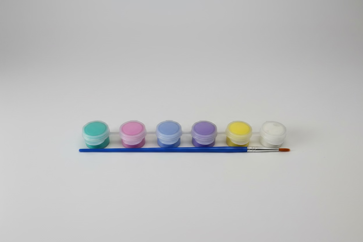 Set of paints with a brush on a white background