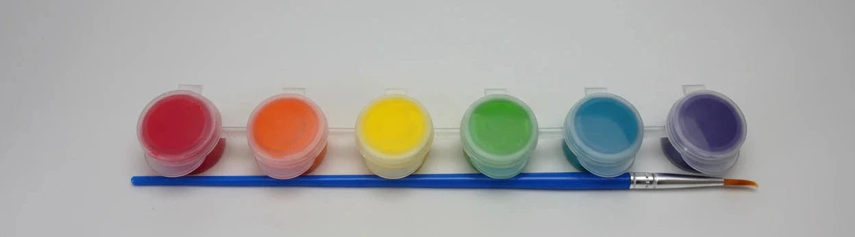 Set of six small paint containers with a brush on a white background